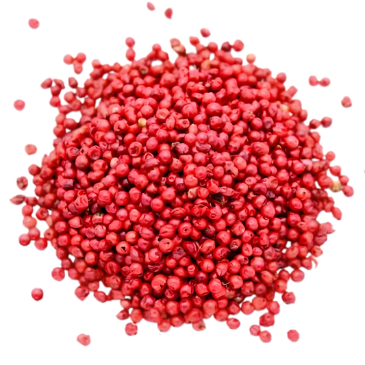 Gros plan de baies roses entières SAMIA, épices aromatiques pour cuisine salée, parfaites pour relever viandes et sauces.