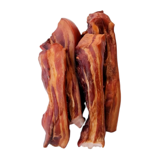 Morceaux de Boucane Créole Réunion, salaison de porc fumé Bourbon, viande surgelée à la texture marbrée, idéale pour plats traditionnels.