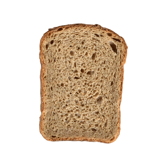 Tranche de pain de mie 100% complet Rochambeau, texture moelleuse et riche en fibres, parfaite pour des repas sains et nutritifs.