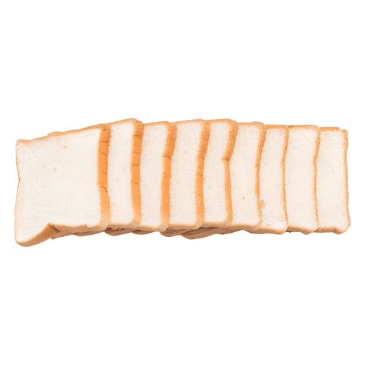 Tranches de pain de mie blanc Rochambeau alignées, parfaites pour toasts et sandwichs en boulangerie ou usage quotidien.