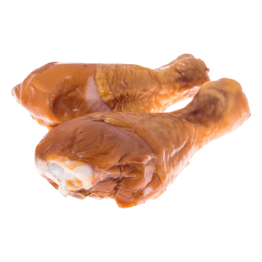 Deux pilons de poulet fumés prêts à cuisiner, issus de volaille surgelée. Idéal pour recettes savoureuses et pratiques au goût fumé.