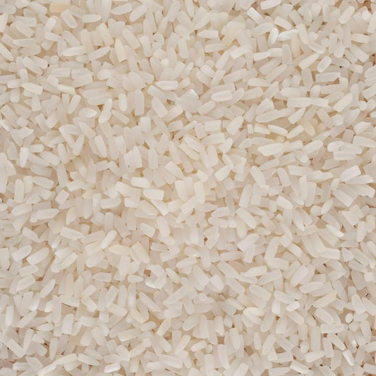 Gros plan sur grains de riz jasmin cassé ORCHIDÉE, texture fine et blanche, parfait pour recettes asiatiques. Riz parfumé à cuisson rapide.