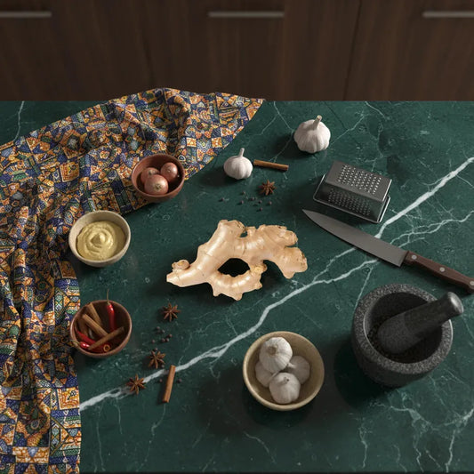 Racine de gingembre sur plan de travail avec épices et ustensiles, ingrédient clé pour recettes savoureuses et bienfaits santé.