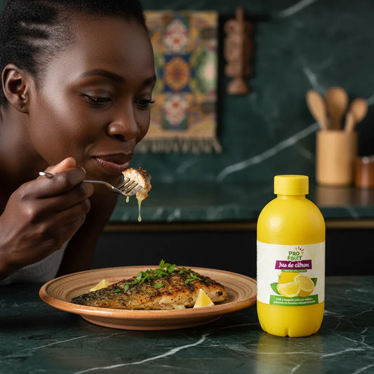 Femme dégustant un plat de poisson assaisonné avec le jus de citron concentré PROFRUIT. Saveur acidulée idéale pour sublimer les repas.