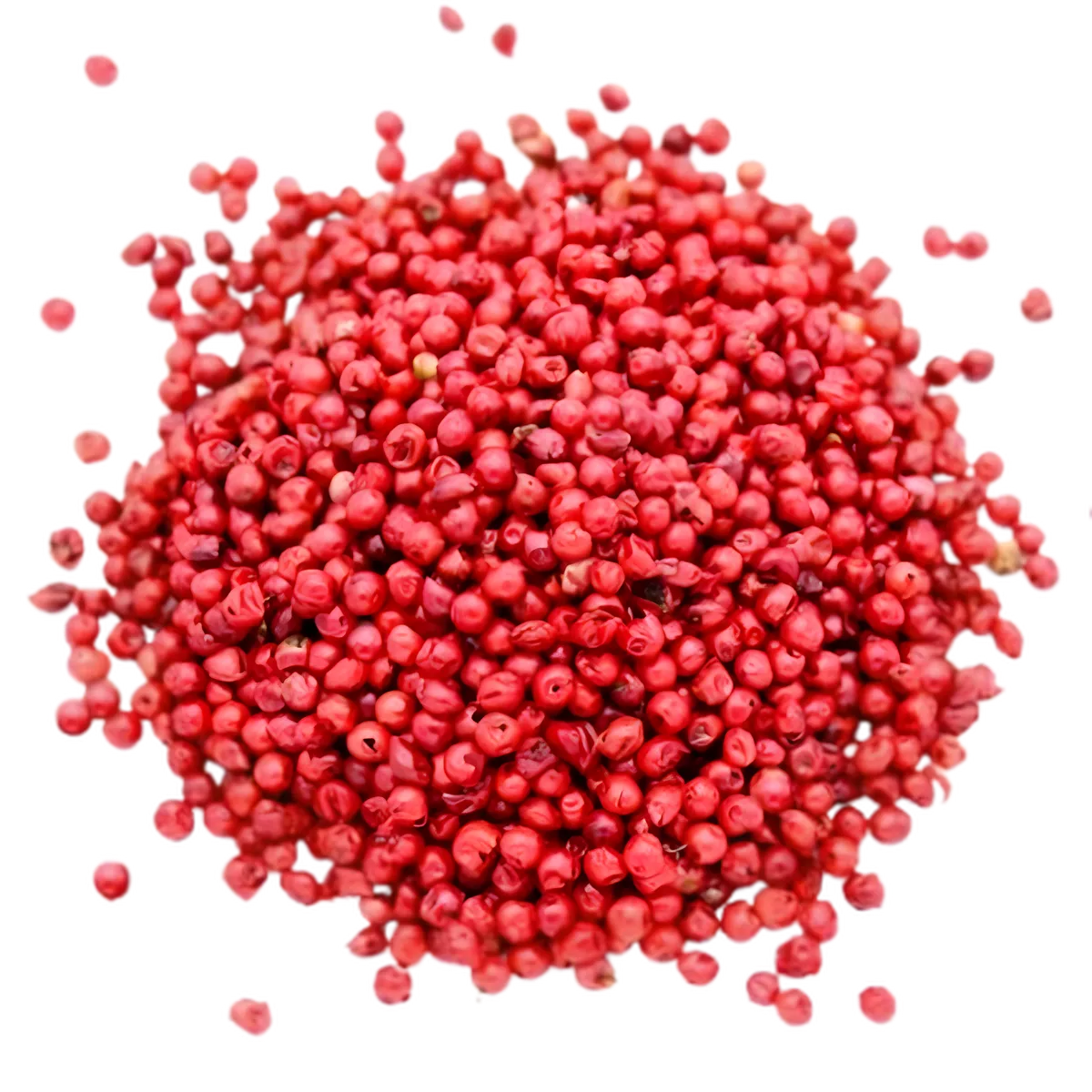 Gros plan sur un tas de baies roses entières SAMIA. Épices décoratives et aromatiques pour plats salés et créations culinaires.