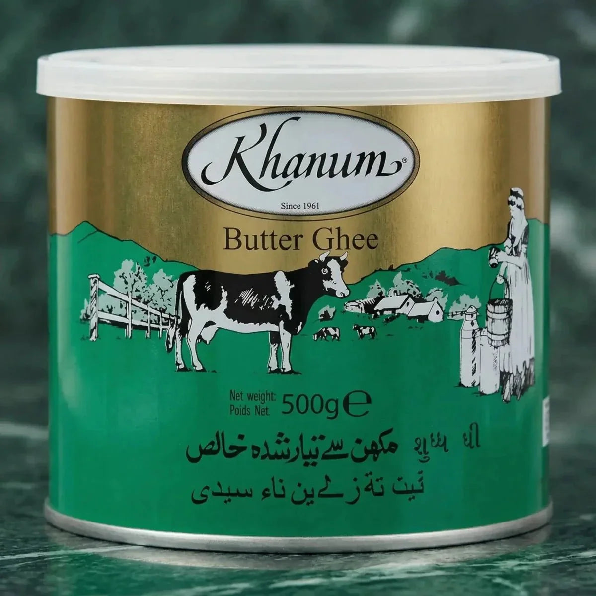 Khanum brand ghee butter, with an illustration of a dairy cow and a rural landscape.