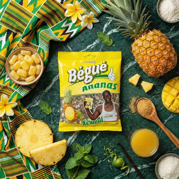 Bonbons BÉGUÉ Ananas 400g, emballage jaune, ananas frais, mangue, bol bonbons.