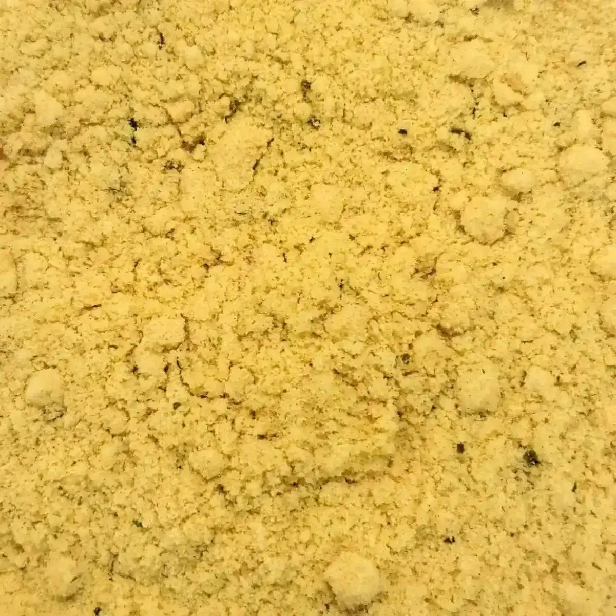 Texture granuleuse du bouillon poudre aroma JUMBO, assaisonnement concentré pour rehausser les plats salés avec intensité.