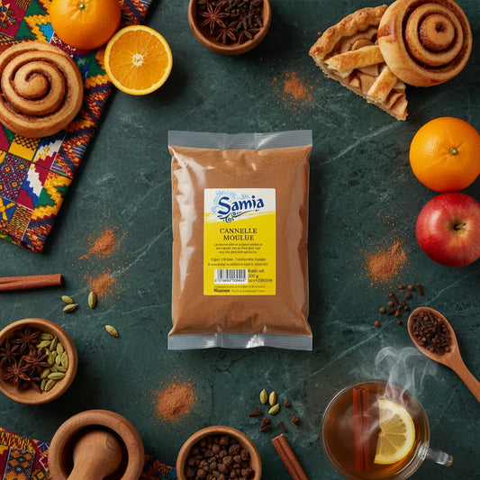 Cannelle moulue SAMIA entourée d’ingrédients naturels comme pommes, oranges et épices - Cannelle Moulue Bio pour cuisine variée.