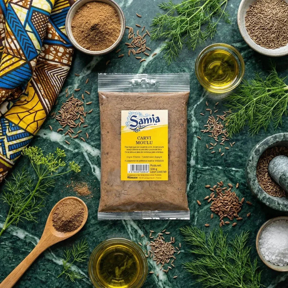 Carvi moulu SAMIA de 100g, entouré d'ingrédients, d'épices, d'huile et d'herbes, vert marbré.
