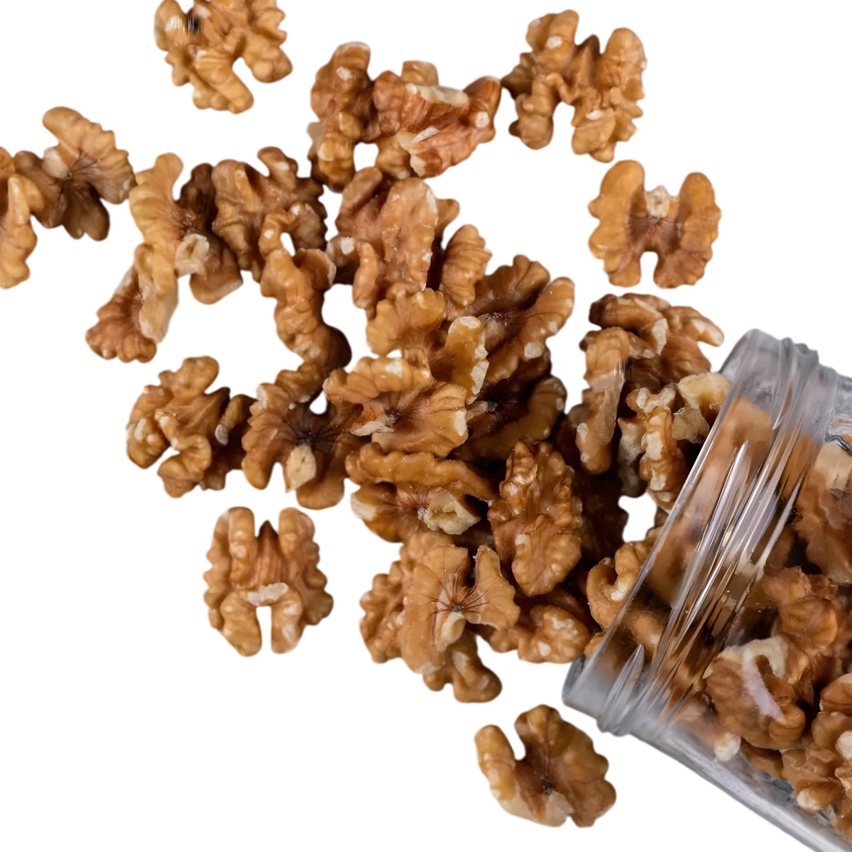 Cerneaux de noix PROFRUIT déversés d’un bocal, idéals pour enrichir vos recettes avec une touche croquante et nutritive.
