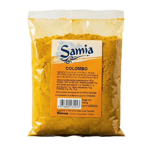 Bolsa de Colombo SAMIA, mezcla de especias amarillas. Empaque de plástico transparente sobre fondo liso.