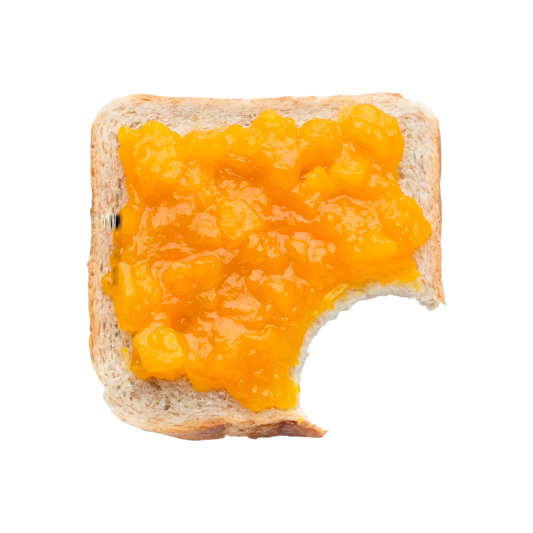 Tartine de pain avec confiture ananas bio onctueuse, texture riche et naturelle, parfaite pour petit-déjeuner ou collation sucrée.