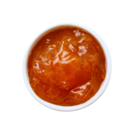 Vue de dessus de la confiture de goyave M'AMOUR dans un bol blanc, texture épaisse et brillante. Parfait pour les amateurs de confiture sucrée.