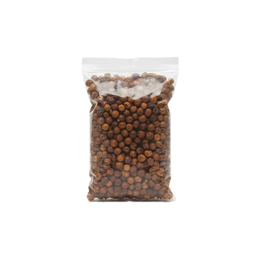 Épice gnangnan en grain dans un sachet transparent sans étiquette, idéale pour la cuisine africaine et les recettes épicées - ÉPICERIE SALÉE - NKOSI.