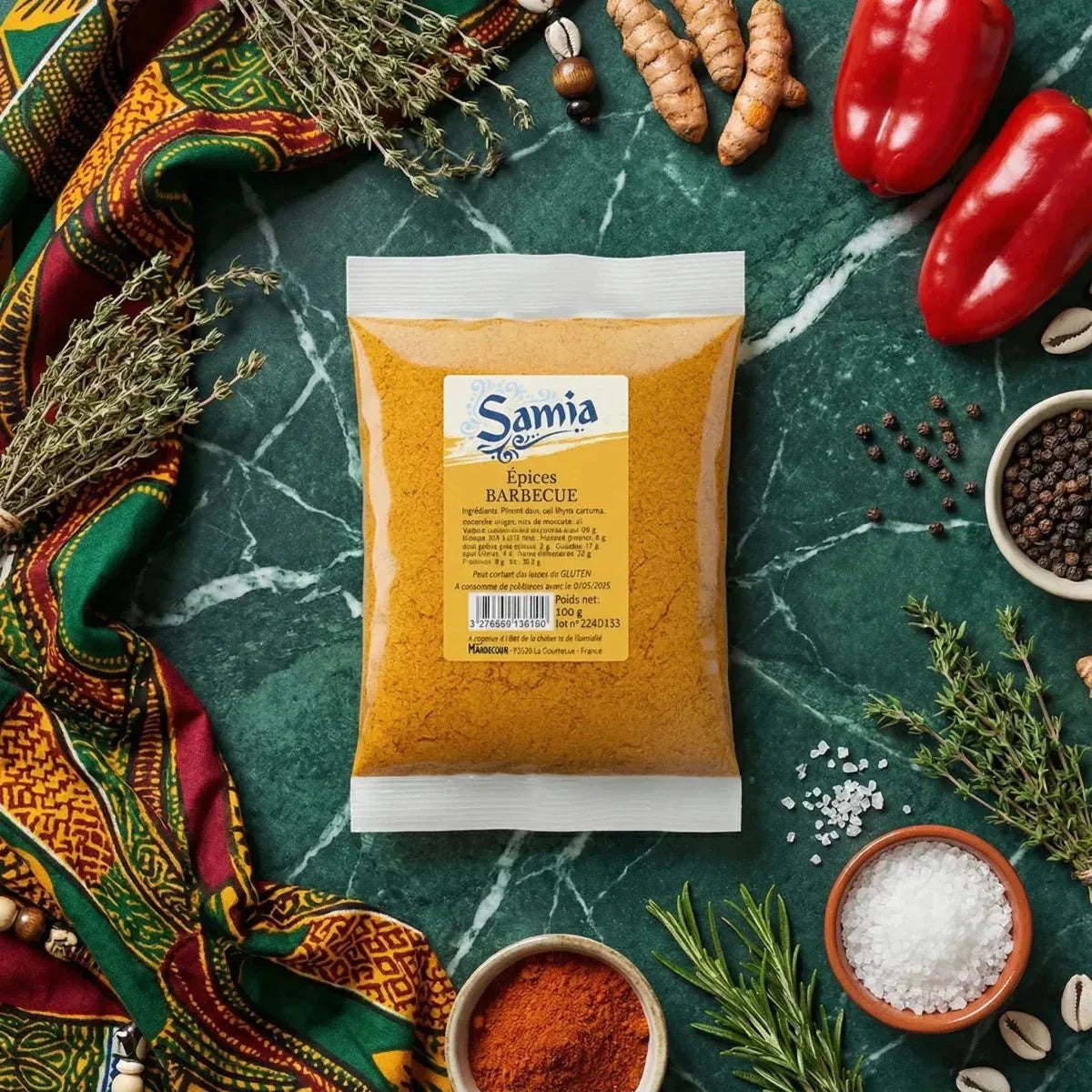 Samia barbecue spice sachet on a marbled green background with spices and vegetables.