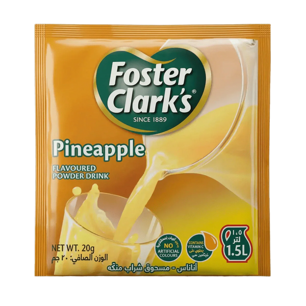 Sachet orange Foster Clark's de poudre pour boisson ananas versée dans un verre.