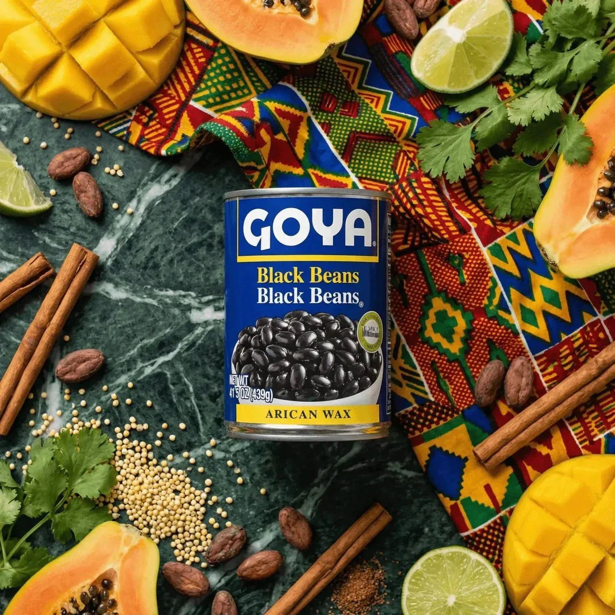 GOYA black beans 439g. Colorful still life with mango, papaya, cilantro, lime.