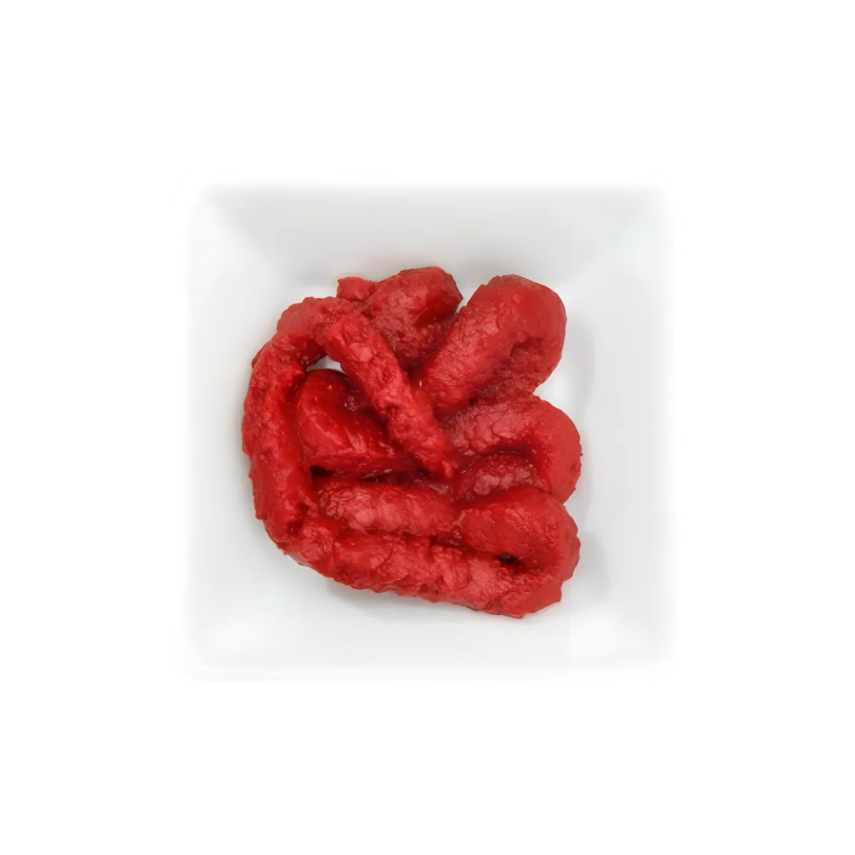 Pâte de harissa rouge onctueuse Phare du Cap Bon servie dans une coupelle blanche, parfaite pour assaisonner vos recettes avec intensité.