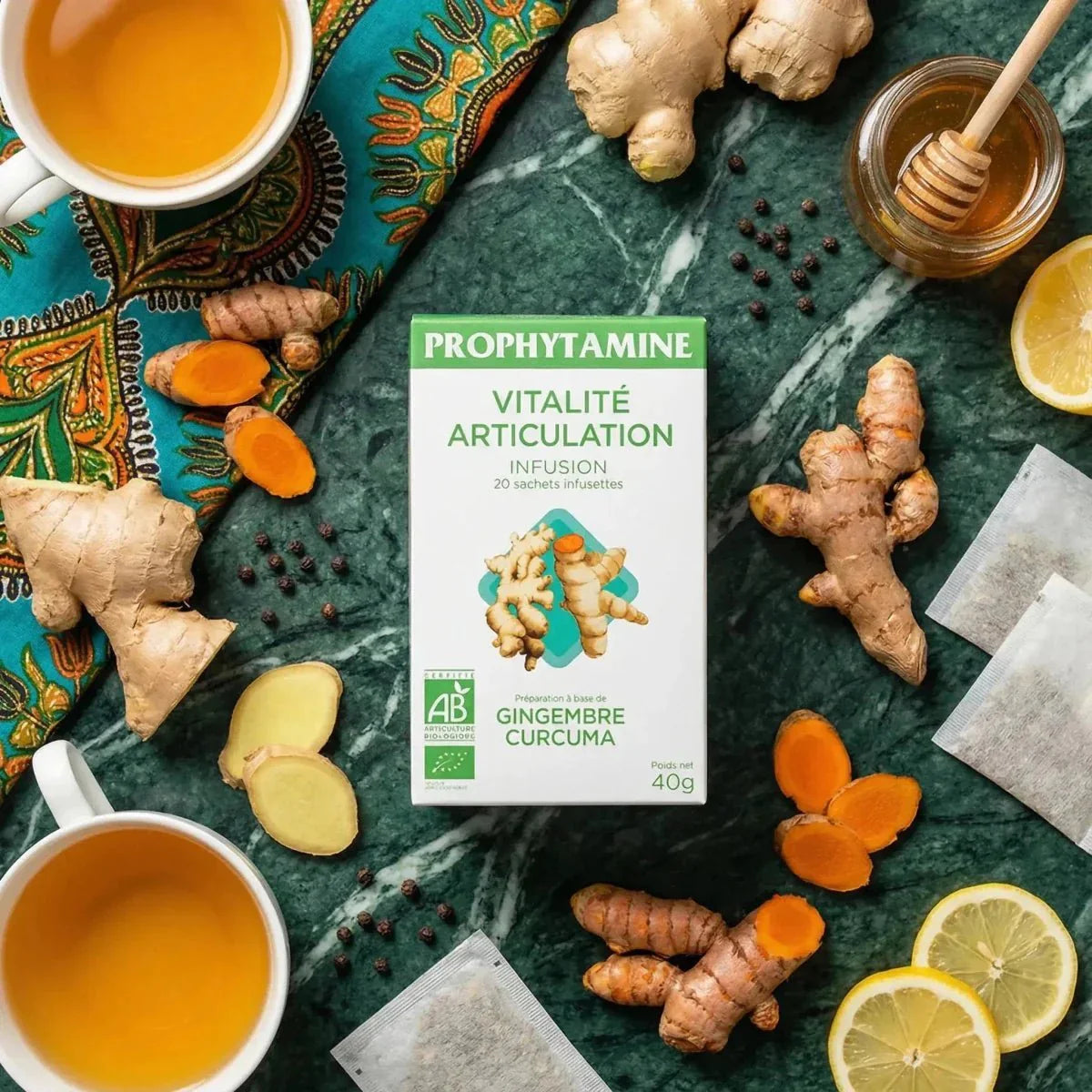 Organic PROPHYTAMINE Vitality Joint Infusion. Displayed with ginger, turmeric, lemon.