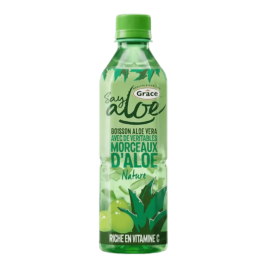 Fles GRACE aloëverasap. Opschrift "Say Aloe-nature". Vitamine C.