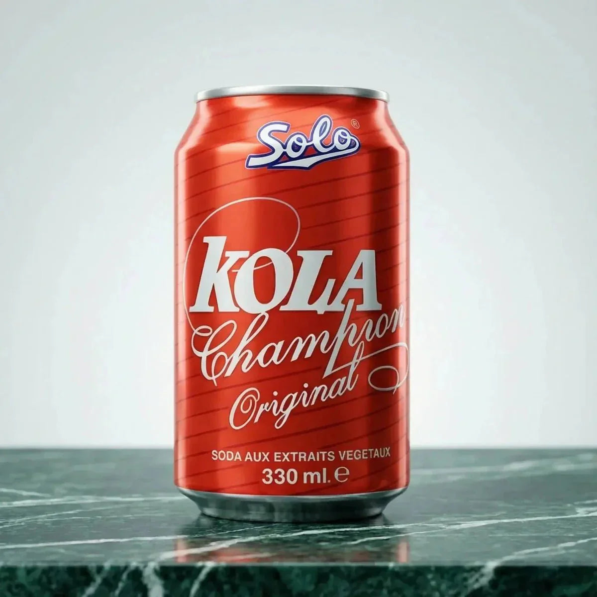 Can of SOLO Kola Champion, 330mL, on a green marble surface, in front of a light background.