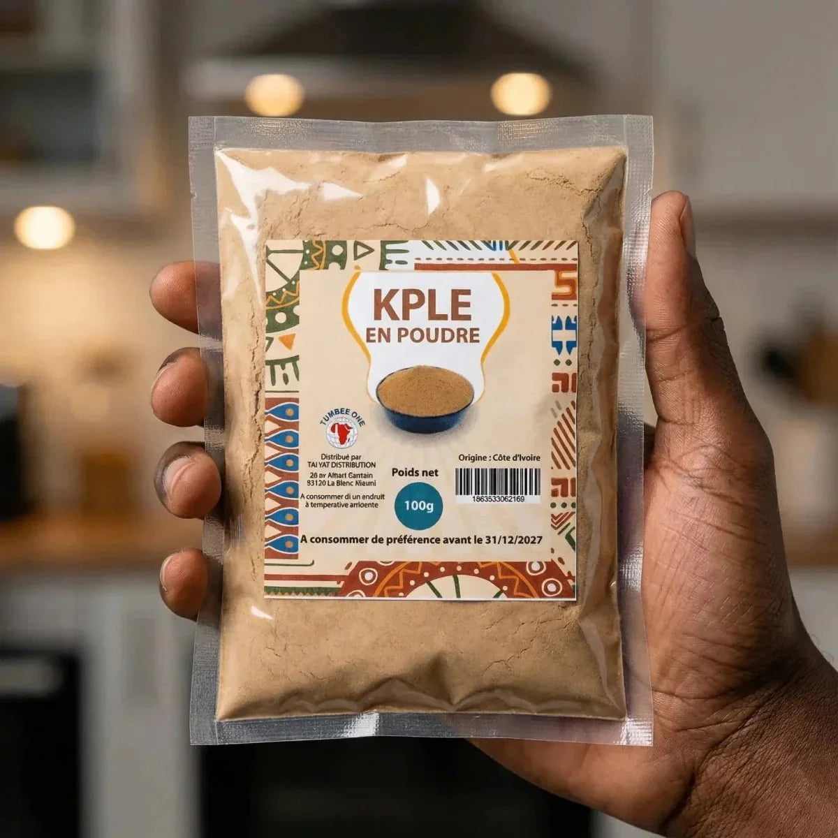 Kpele powder from TUMBEE ONE, in a transparent bag with ethnic patterns.
