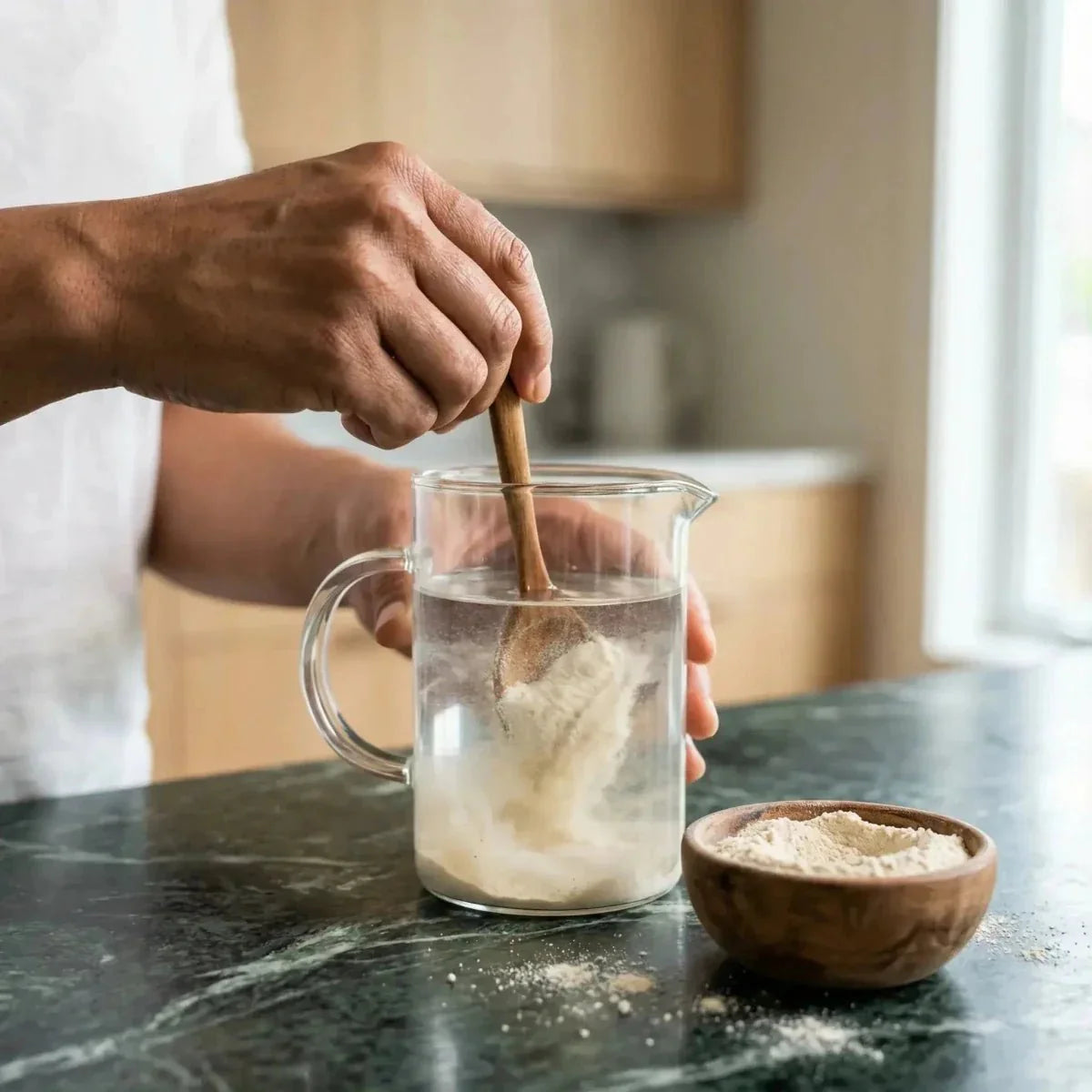 Ground white Lalo NUMBER ONE. Mixture of white powder in a pitcher of water.