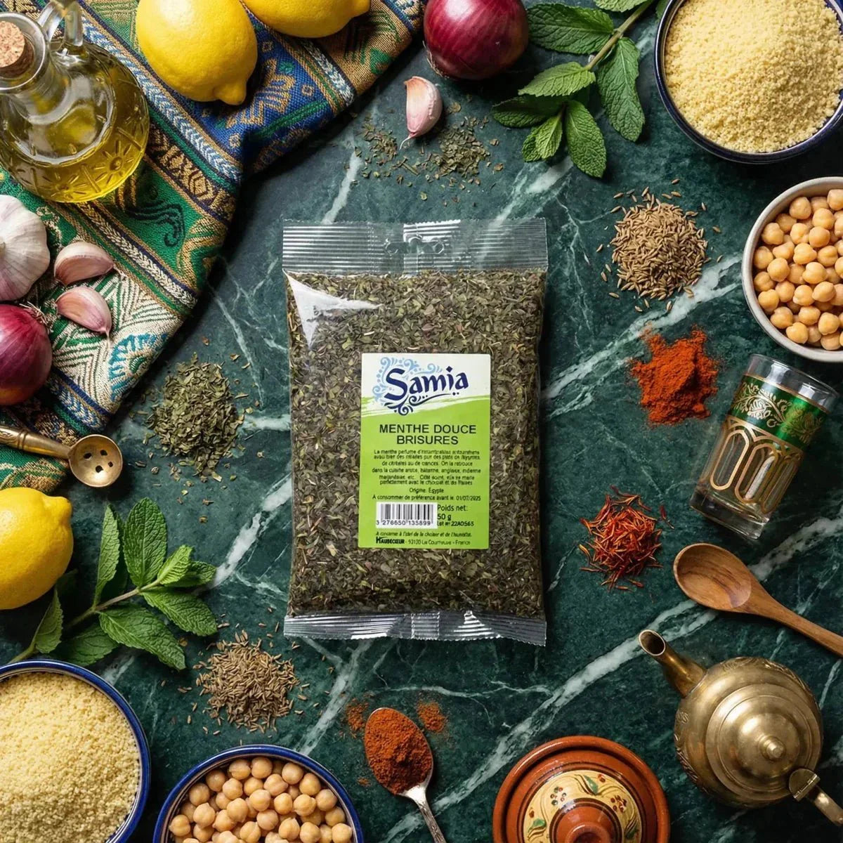 Packet of crushed sweet mint SAMIA on a table scattered with ingredients: couscous.