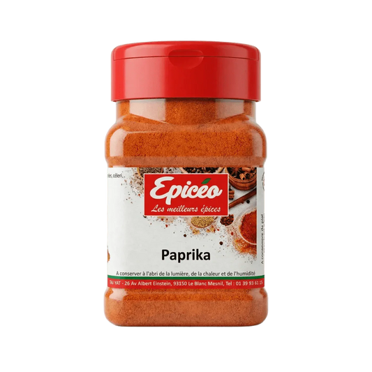 Boîte de paprika EPICÉO, 100g, sur fond vert. Le pot est rempli d'épice rouge.
