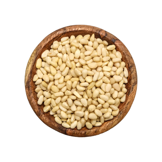 Pignons de pin PROFRUIT présentés dans un bol en bois, texture tendre et goût délicat, parfaits pour recettes sucrées ou salées - NKOSI.