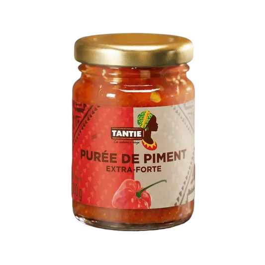 Extra sterke pepersaus TANTIE in een pot van 100g. De verpakking is rood.