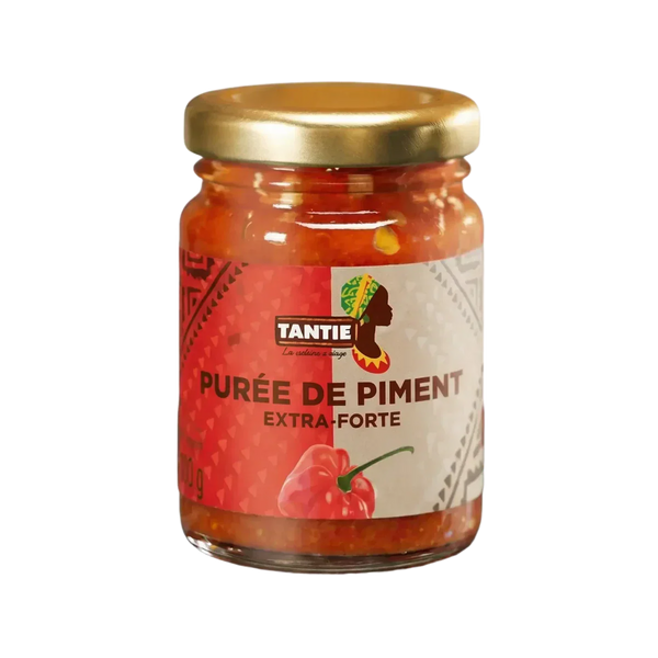 Extra hot chili pepper puree TANTIE in a 100g jar. The packaging is red.
