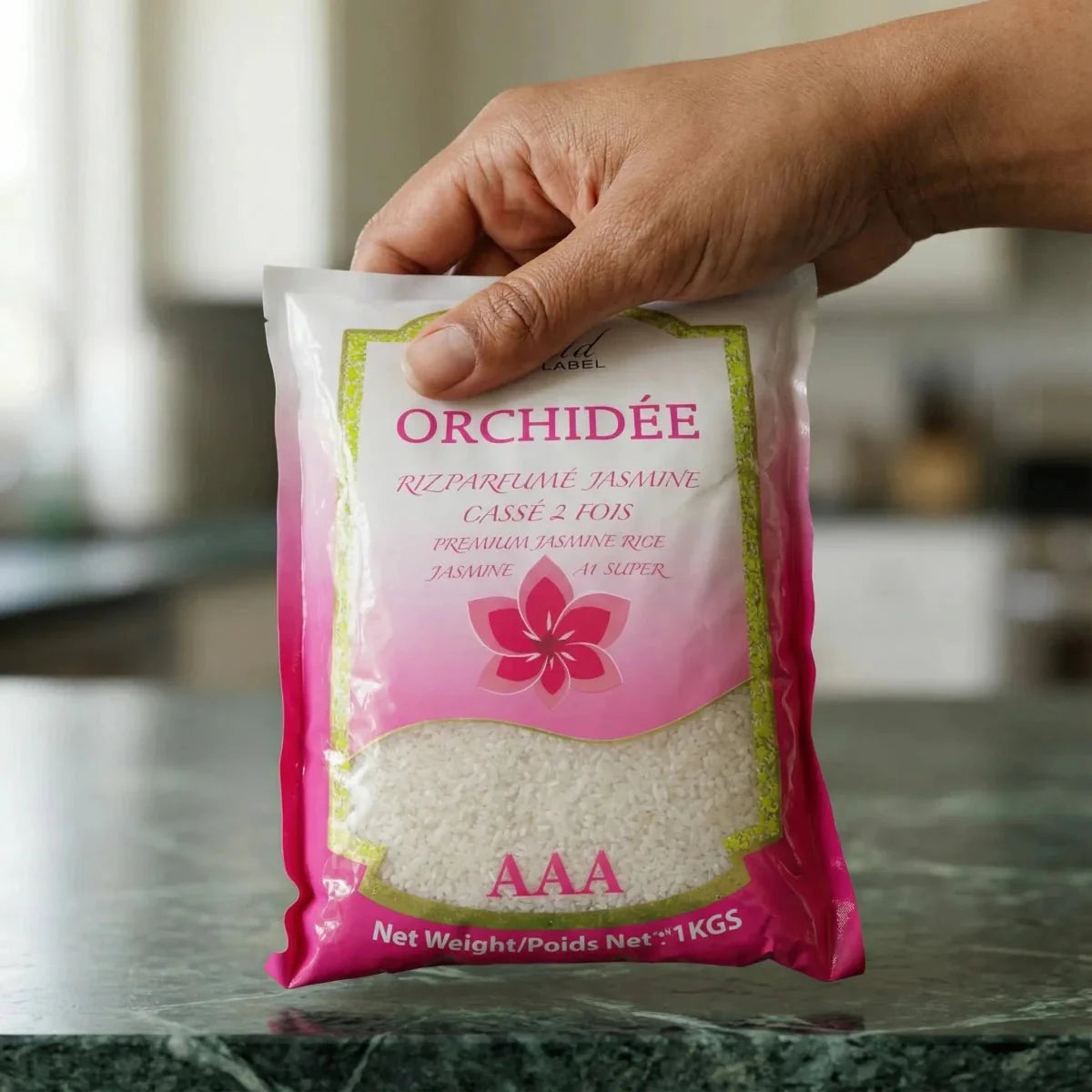 Jasmine scented rice, Twice Broken Gold Label, in a pink and white package.