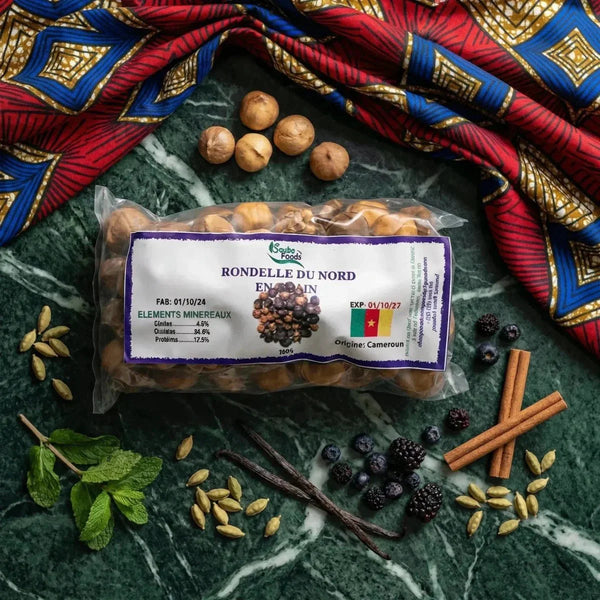 Saubo Foods, Rondelle du Nord en grain, entouré de fruits et d'épices sur une pierre de marbre.