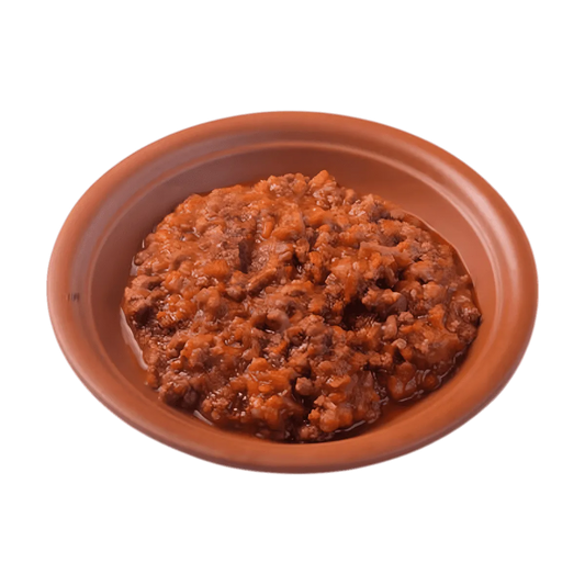 Contenu de la sauce bolognaise halal ZAKIA présenté dans une assiette, texture riche et onctueuse pour accompagner les recettes de pâtes traditionnelles.