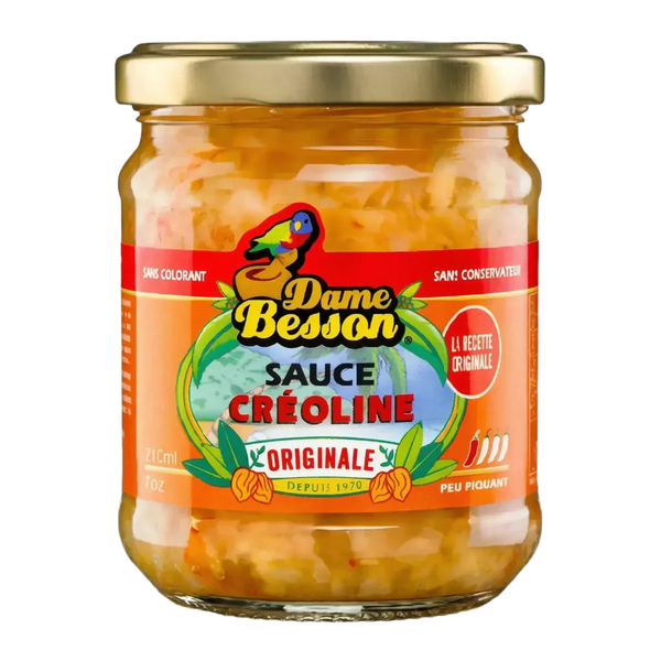 Bocal de sauce créoline DAME BESSON. Sauce créole en pot, avec logo coloré, sur fond noir.
