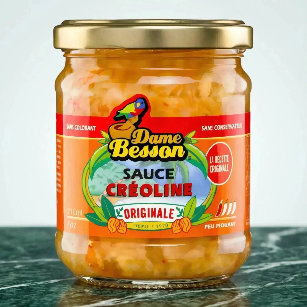 Creole sauce in a jar from Dame Besson, with a colorful label on an orange background.