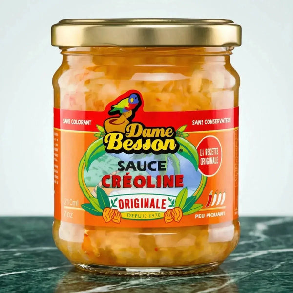 Sauce créoline en bocal de Dame Besson, avec une étiquette colorée sur fond orange.