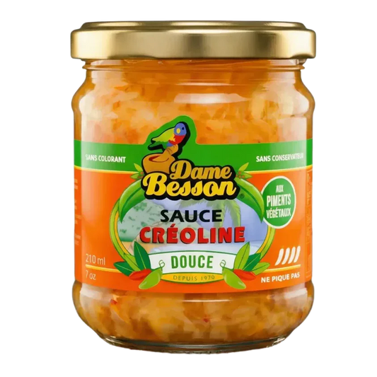 Pot zoete Creoolse saus DAME BESSON. Het kleurrijke etiket toont een papegaai en pepers.
