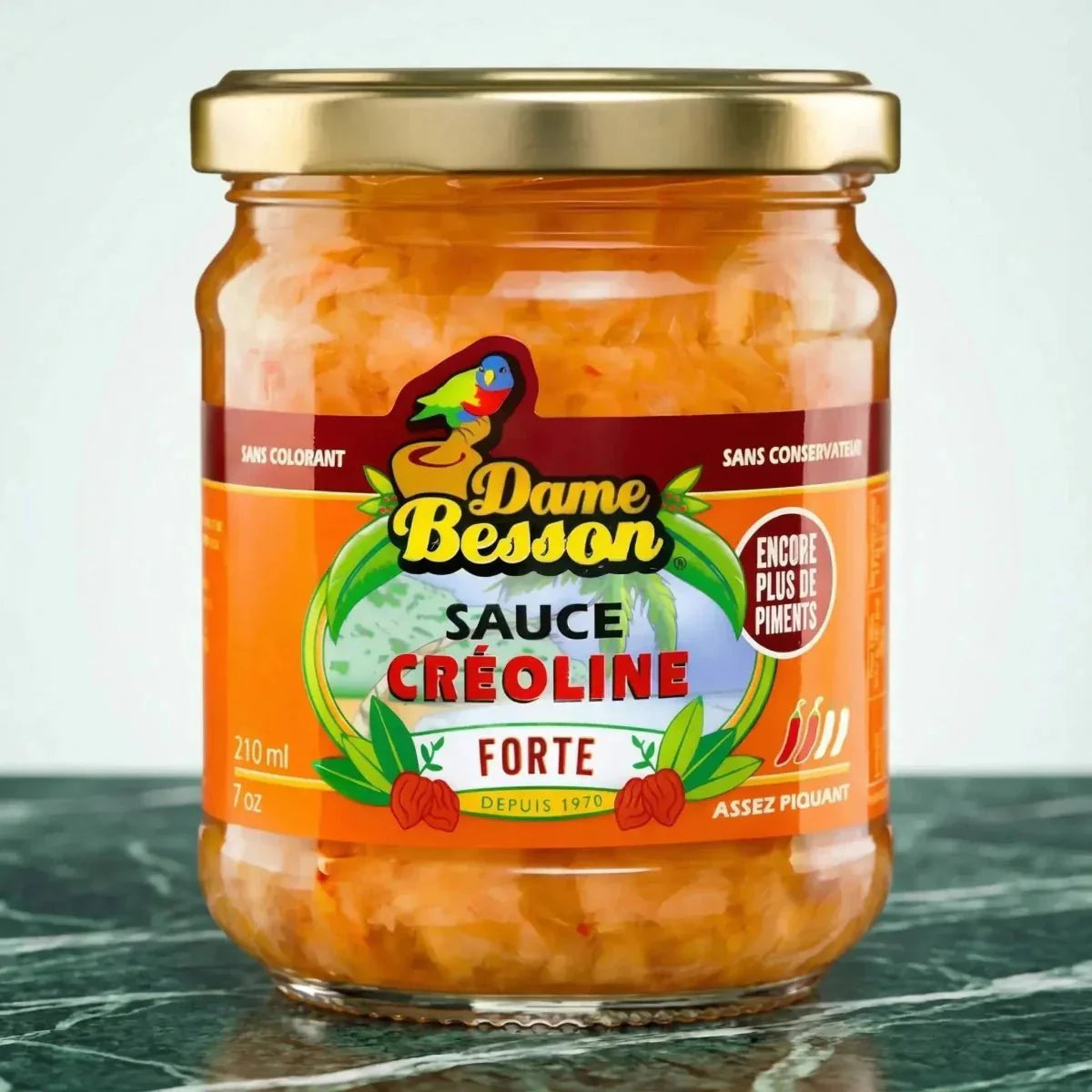 Sauce créoline forte de Dame Besson, en bocal de verre avec couvercle doré et étiquette orange.
