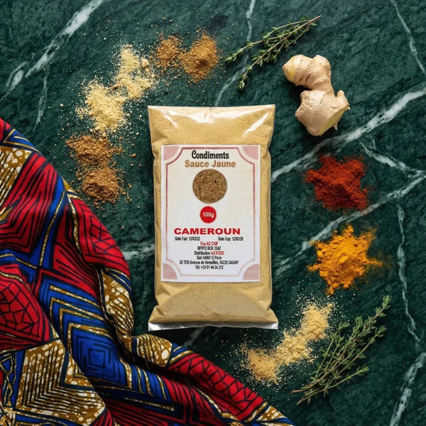 Yellow Sauce Condiment by AG Food, 100g. Packet on a textured background with spices, ginger.