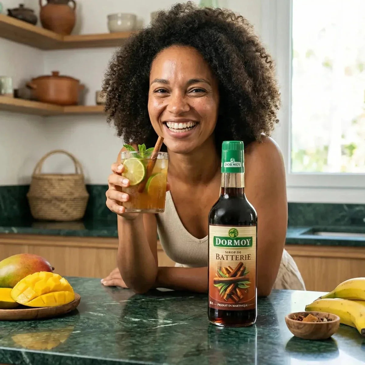 Battery syrup, DORMOY, displayed on a kitchen counter with a cold drink.