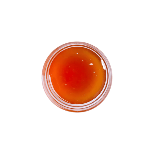 Vue du dessus du sirop de glucose SAMIA à la texture lisse et couleur ambrée, parfait pour recettes sucrées - ÉPICERIE SUCRÉE - NKOSI.