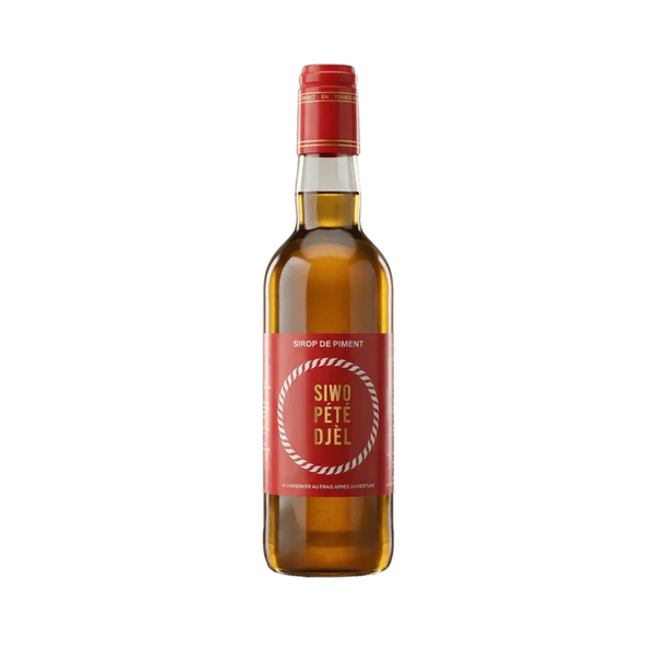 Bouteille de sirop de piment SIWO PETE DJEL 50cL sur fond vert. Marque SIWO PÉTÉ DJÉL.