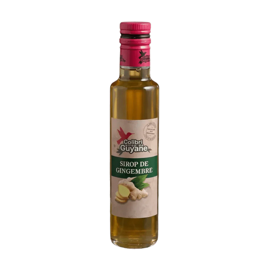 Sirop de gingembre, DELICES DE GUYANE, en bouteille de verre transparente avec une étiquette verte.