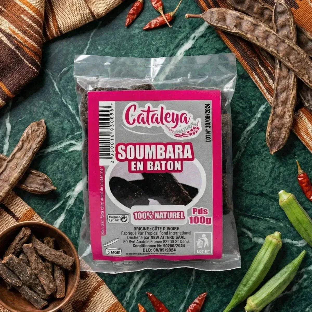 Soumbara en bâton by CATALEYA, présenté dans un emballage en plastique avec des piments rouges.