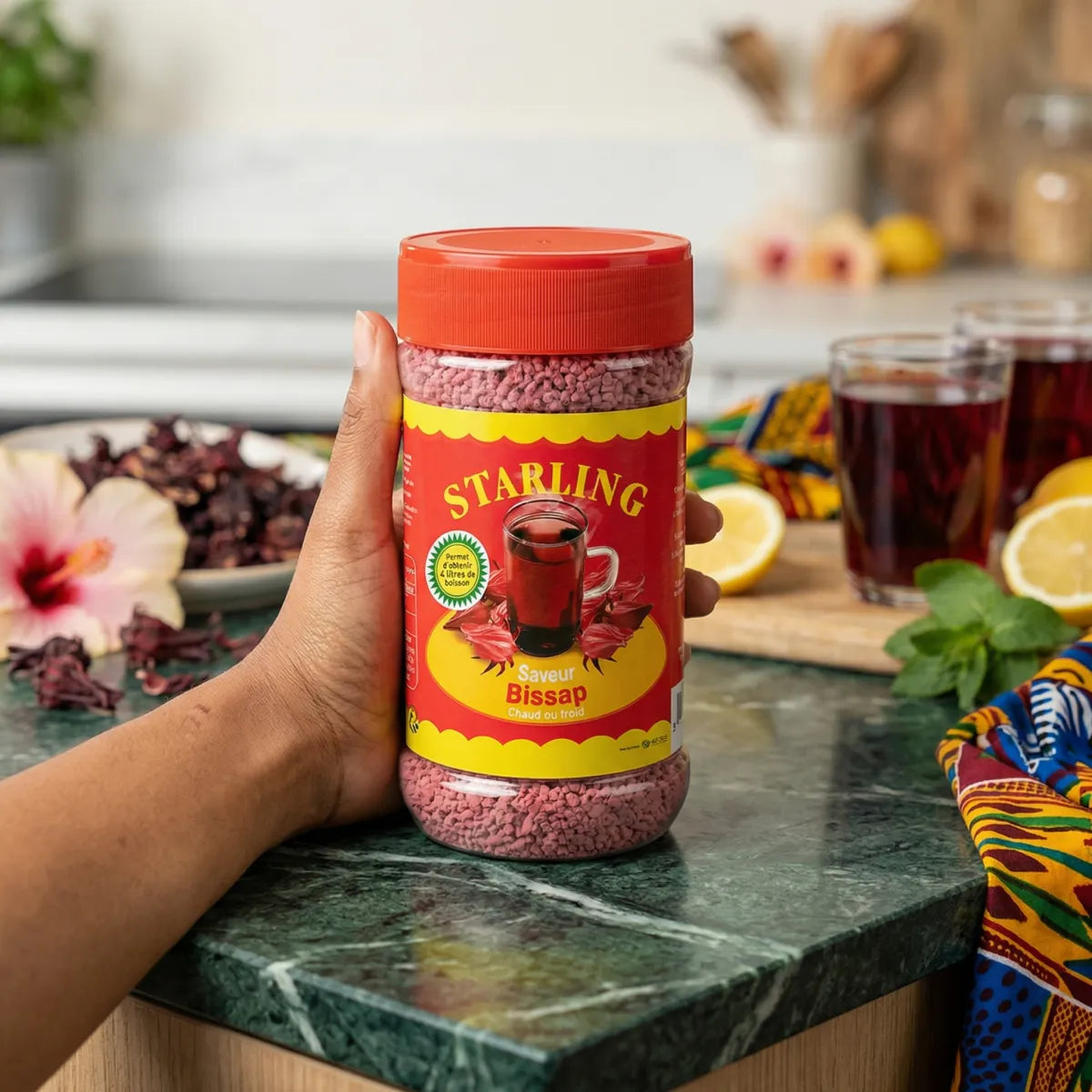 Instant hibiscus tea by Starling, in a clear jar with an orange lid.