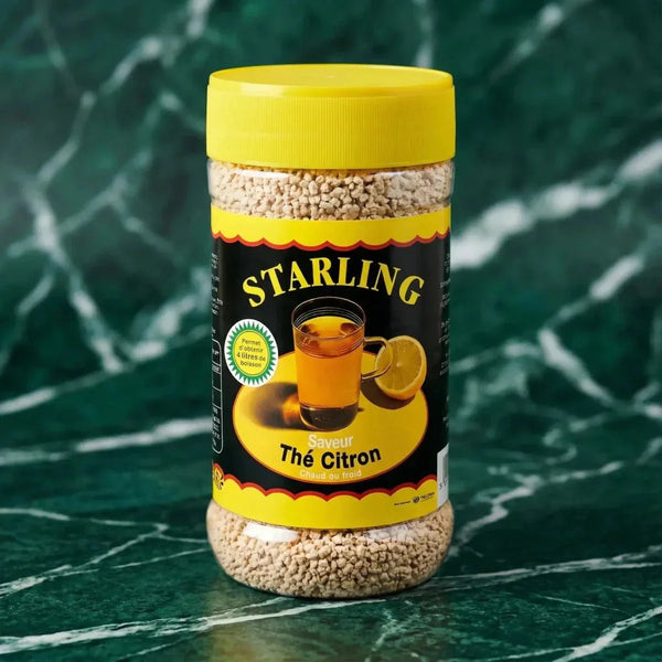 Lemon tea granules from Starling, in a plastic jar with a yellow lid.