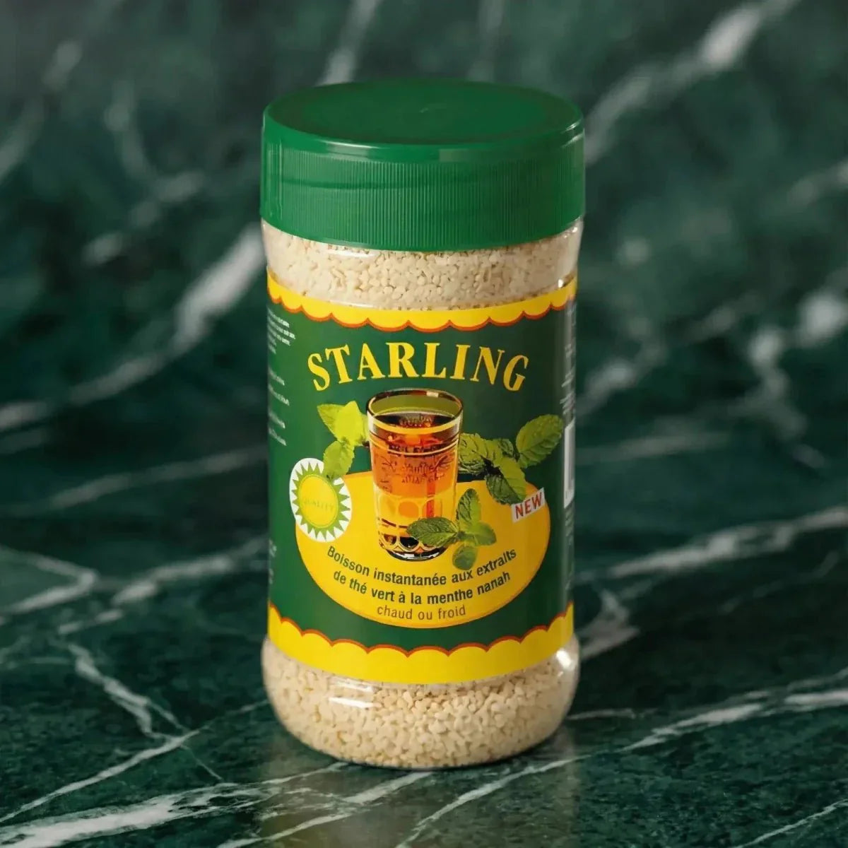 Instant muntthee Nanah van STARLING, in een doorzichtige pot met een groene deksel.